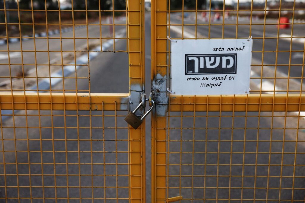 A fence sits locked at the entrance to the Kerem Shalom border crossing near Rafah on May 17.
