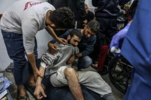 Palestinian men who were arrested during the Israeli ground invasion of northern Gaza receive medical treatment after their release at Al-Najjar Hospital in Rafah, December 24, 2023