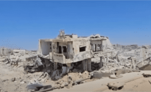 Israeli tank destroys a building in Rafah
