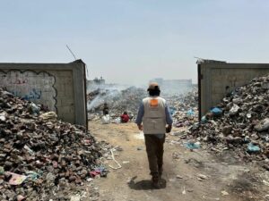 Solid waste piles up in Gaza due to fuel shortages, impacting essential services and increasing disease risk.