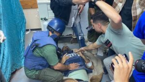 Injured journalist from TRT Arabic channeI is brought to an hospital for medical treatment after an Israeli attack at the Nuseirat Refugee Camp in Deir Al Balah, Gaza on April 12, 2024.