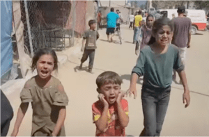 Traumatized children escape the al Mawasi area – an Israeli-designated "safe zone" – after an intense and unexpected Israeli bombing on Saturday, July 13.