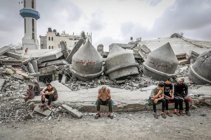 Palestinians at the site of a mosque destroyed in an Israeli airstrike, near the Shaboura refugee camp in Rafah, southern Gaza Strip, April 26, 2024.