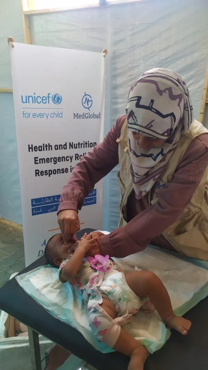 Treating a patient at MedGlobal's nutrition center in August 2024 in Rafah, in southern Gaza.