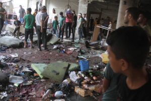 Palestinians inspect the destroyed building after an Israeli attack at the Et-Tabiin school where displaced people took shelter in the Ed-Deraj neighborhood in Gaza City, Gaza on August 10, 2024. [Mahmoud İssa – Anadolu Agency]