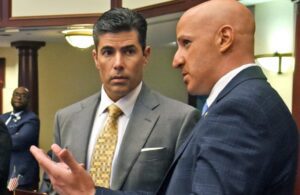 From the left Rules & Policy Committee Chair Jose R. Oliva, R-Hialeah, and Rep. Joseph Abruzzo, D-Boca Raton, confer on the House floor April 13, 2017.