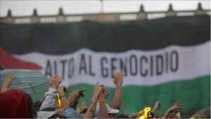 A Palestinian Flag as it reads in Spanish, Alto al Genocidio (Stop Genocide) during the Concert of Hope in solidarity for Palestine in the Plaza de Bolivar in Bogota, Colombia on July 5, 2024.