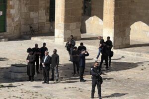 Israel’s far-right National Security Minister Itamar Ben-Gvir (2nd L) forces his way into the flashpoint Al-Aqsa Mosque complex under police protection in East Jerusalem on 18 July 2024 [Stringer/Anadolu Agency]