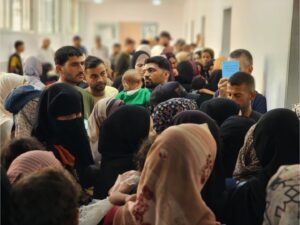 Palestinian families line up with their children to receive polio vaccines from the Palestine Red Crescent Society at al-Amal Hospital in southern Gaza’s Khan Younis city on August 22 [Hani Alshaer/Anadolu Images]