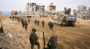 Israeli forces make their way between destroyed buildings and infrastructure in Gaza. (Photo credit: Israeli army)