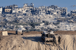 Israeli troops observe the Gaza Strip from the Israeli side of the border on August 29 (Jack Guez/AFP/Getty Images)