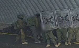 A still image, captured from a video recently released, shows Israeli soldiers raping a Palestinian prisoner, hiding their faces, and taking cover behind shields to avoid being seen on cameras.