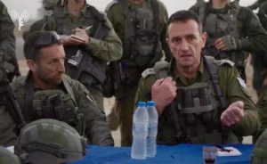 Brig. Gen. Barak Hiram, left, with Israeli army chief Lt. Gen. Herzi Halevi, in the Gaza Strip in May 2024. A new report endorsed by Halevi praises Hiram and covers up how he ordered Israeli tank fire that killed multiple Israeli civilians in Kibbutz Be’eri on 7 October 2023. (Israeli army video via Facebook)