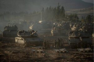 Israeli tanks and APC’s gather by the Israeli – Lebanese border. Amid Israel’s escalating campaign against Hezbollah in Lebanon on September 30, 2024. [Erik Marmor/Getty Images]