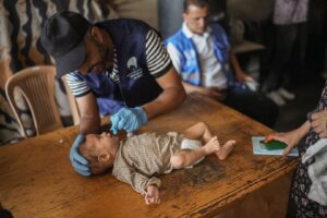 A baby receives a polio vaccine in Gaza