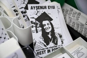 Posters of 26 year old Turkish-American Aysenur Ezgi who was killed by Israeli forces in Nablus, as she was standing in solidarity with the Palestinian people during a pro-Palestinian demonstration at Westlake Park, in Seattle, Washington, United States on 7 September, 2024 [Tayfun Coşkun/Anadolu Agency]