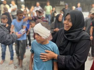 Palestinians injured in an Israeli attack on the Nuseirat refugee camp are brought to the al-Awda hospital for treatment in Gaza City on September 16 [Hassan Jedi/Anadolu Agency]