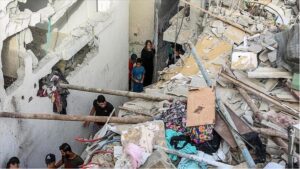 More than 50 people are estimated to have been inside the houses during the Israeli attack on a block of homes in Al Bureij refugee camp, Gaza