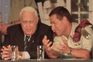 Doron Almog (left) talking with former prime minister of Israel Ariel Sharon, who was known as the "Butcher of Beirut"