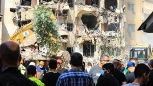 People gather on Sept. 21, 2024 at the scene of an Israeli strike that targeted Beirut's southern suburbs a day earlier. Israeli officials said another Israeli airstrike on Sept. 23 targeted Hezbollah's southern front commander. Photo: -/AFP via Getty Images