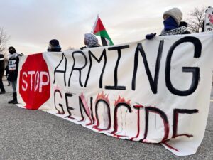 Demonstrators, led by the Maine Coalition for Palestine, protest at a General Dynamics factory in Saco, Maine on Jan. 3, 2024. (courtesy of Schaible, Maine Voices for Palestinian Rights)