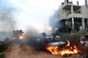 A view of damaged houses and burning vehicles after a raid by Jewish settlers on the Mughir town near Ramallah, West Bank on April 12, 2024. [Issam Rimawi – Anadolu Agency]