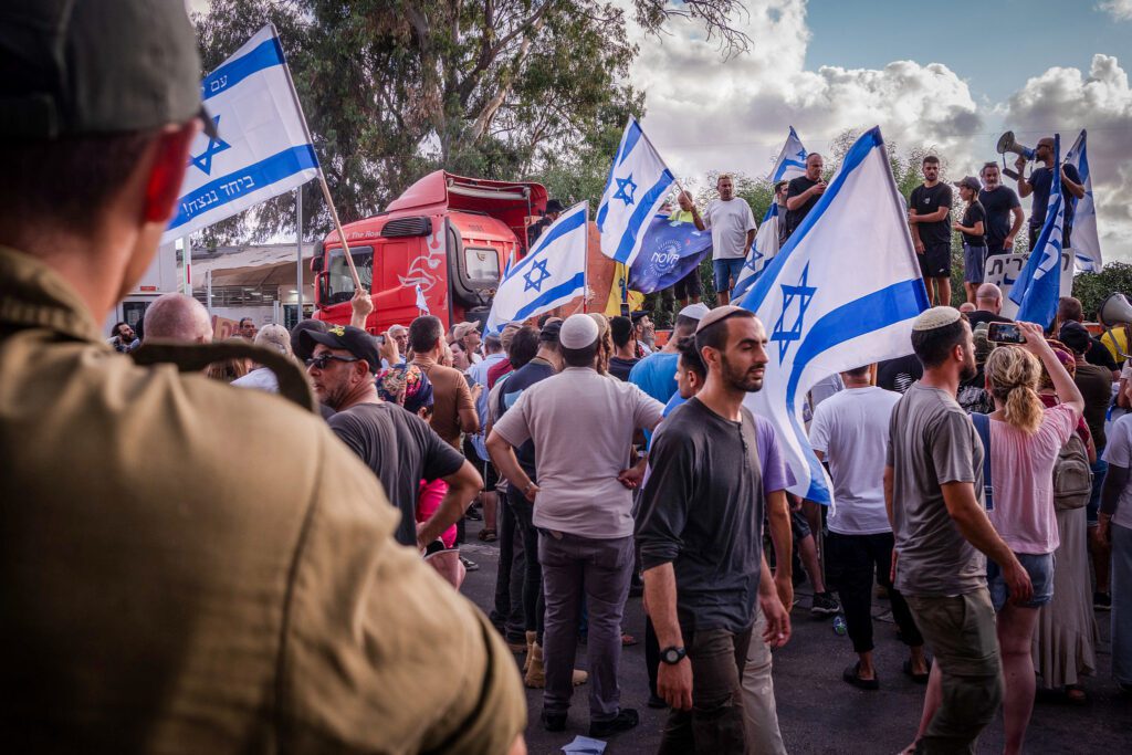 Protest against the detention of Israeli reserve soldiers suspected of sexually assaulting a Palestinian prisoner, at the Beit Lid military base, July 29, 2024. (Chen Leopold/Flash90)