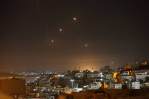 Many rockets, fired from Iran, are seen over Jerusalem from Hebron, West Bank on October 01, 2024 [Wisam Hashlamoun – Anadolu Agency]