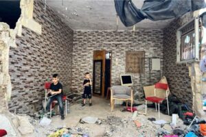 Akram Nassar's children, Rahim and Bara, in their partially demolished house, Tulkarem refugee camp, occupied West Bank, September 16, 2024