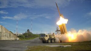 The launching of a Terminal High Altitude Area Defense (THAAD) interceptor.