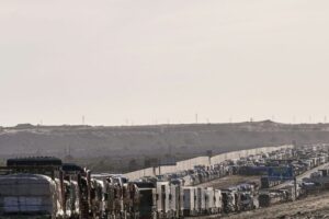 Aid trucks loaded with supplies For Gaza are queued in Al-Arish City after the border closed, on May 8, 2024 in Arish, Egypt.