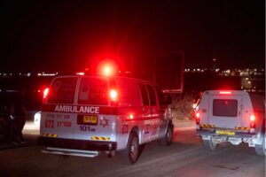 An ambulance arrives at the site of a drone strike near the northern Israeli town of Binyamina, on October 13, 2024, amid the continuing war between Israel and Hezbollah.