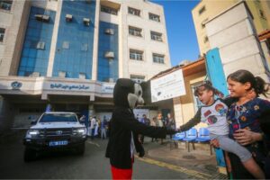 Palestinian children wait at an UNRWA clinic as the second phase of a polio vaccination campaign begins in Gaza