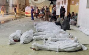 Bodies are seen outside the Kamal Adwan Hospital in northern Gaza, after an Israeli strike on the town of Beit Lahiya killed scores of Palestinians