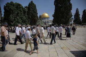 Israeli settlers, under Israeli police protection, are seen as they raid Al-Aqsa Mosque Compound in Jerusalem on 2 June 2019