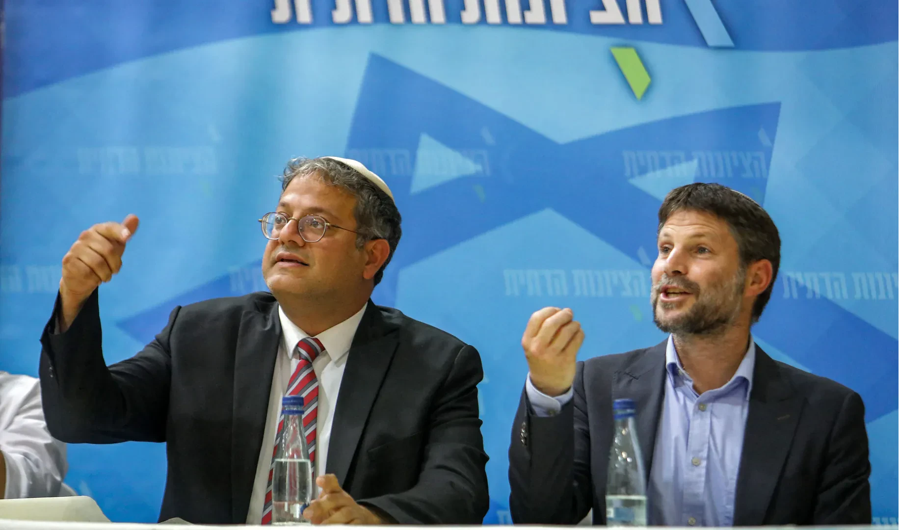 Israeli National Security Minister Itamar Ben Gvir (L) and Finance Minister Bezalel Smotrich