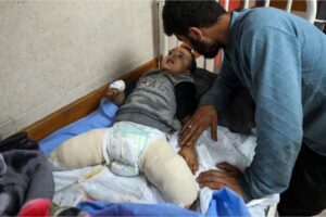 Ahmad Shabat and his uncle Ibrahim Abu Amsheh at the Al-Aqsa Martyrs Hospital in Deir el-Balah, central Gaza Strip