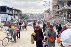 Palestinians, carrying what belongings they can, migrate toward areas they believe to be safer as the Israeli army intensifies its attacks in Jabalia, Gaza on October 6, 2024.