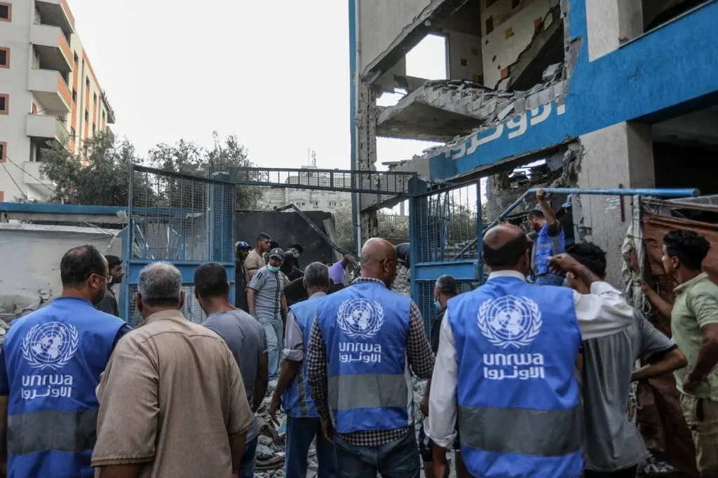 Palestinians and UN workers examine the destroyed makeshift tents and shelters after Israeli attack hits a UNRWA school, killing and injuring many in Nuseirat Refugee Camp of Deir al-Balah, Gaza on July 15, 2024