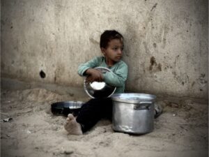 A Palestinian child waits to receive food in southern Khan Younis