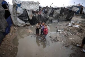 Palestinians, including children, live in makeshift tents in Deir al-Balah, central Gaza, where the rain and cold weather add to their struggles ,November 24, 2024