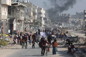 Palestinians carrying belongings on their way in Beit Hanoun, northern Gaza due to the recent Israeli attacks on November 12, 2024.