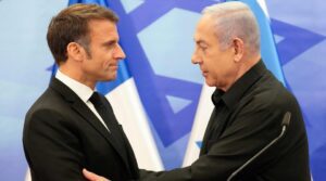 French President Emmanuel Macron shakes hands with Israeli Prime Minister Benjamin Netanyahu after their joint press conference in Jerusalem, Oct. 24, 2023.