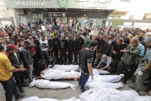 Relatives of the Palestinians who died as a result of Israeli attack on the Nuseirat Refugee Camp mourn as the dead bodies brought to the al-Awda Hospital for burial in Gaza City, Gaza on November 2, 2024