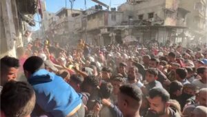 Palestinians, frantic with hunger, wait to buy bread in Khan Younis, Gaza