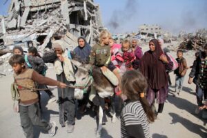 Palestinians carrying essential belongings flee their houses after Israel issued new evacuation orders in the north of the enclave as living and humanitarian conditions deepening due to intense Israeli attacks on Beit Lahia, Gaza Strip on November 05, 2024