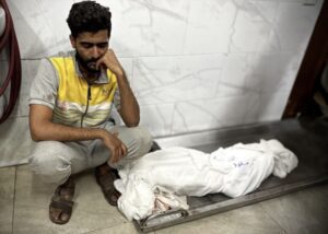 A man mourns as bodies are brought to Nasser Hospital in southern Khan Younis