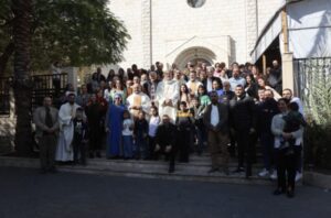 Group photo in front of the Church of the Holy Family in Gaza during the visit of the Latin patriarch of Jerusalem, Cardinal Pierbattista Pizzaballa, on Dec. 22, 2024.