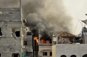 A view of the smoke and fire following an Israeli air attack on the Kamal Adwan Hospital