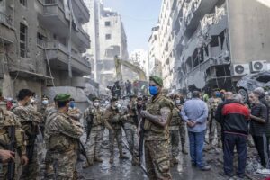 Lebanese civil defense team and soldiers conduct a search and rescue operation following a powerful Israeli airstrike in Beirut, Lebanon on November 23, 2024.